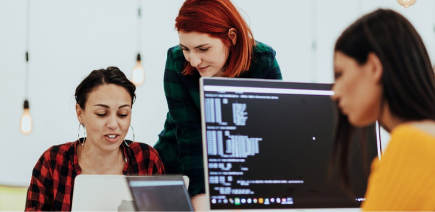 A nearshore software developer works with in-house staff in the staff augmentation outsourcing model