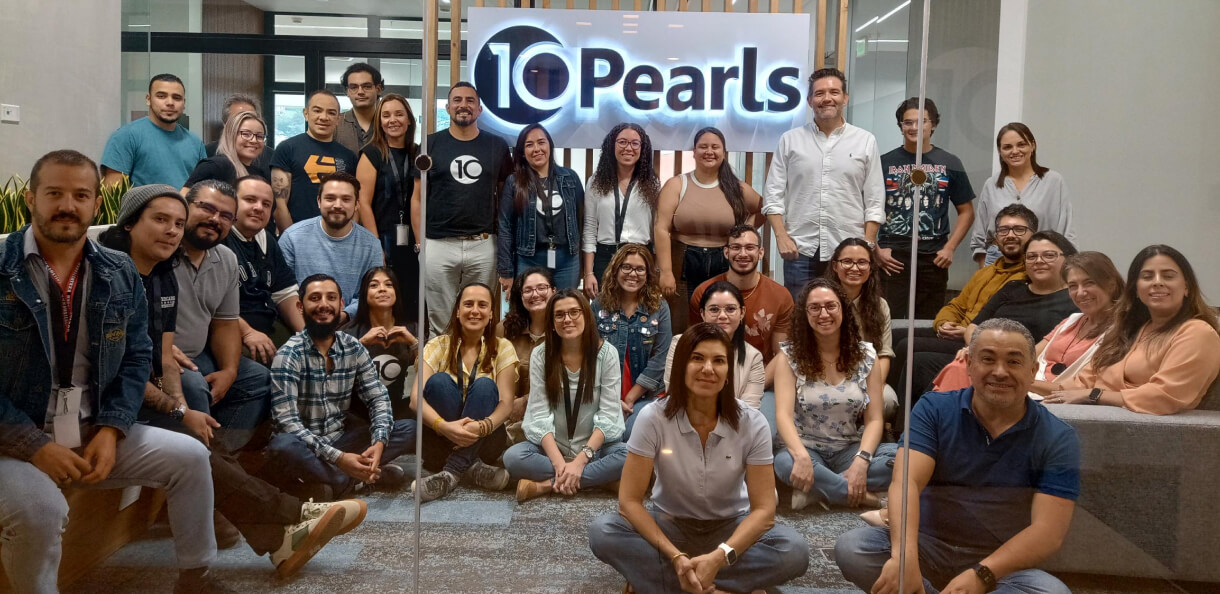 10Pearls LATAM team of agile developers sitting together in office
