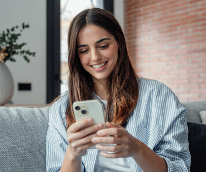 Woman smiling while using mobile application