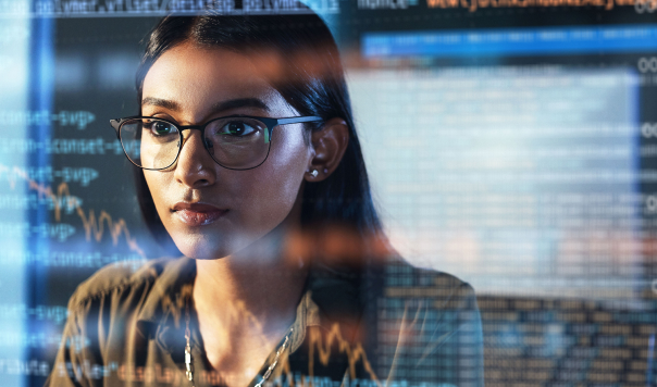 Woman developer focused on ensuring software development security standards are implemented.