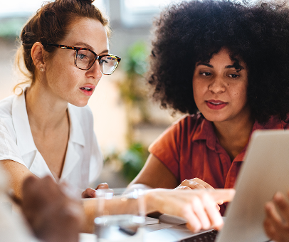 Professionals reviewing the results of their AI maturity assessment guide.