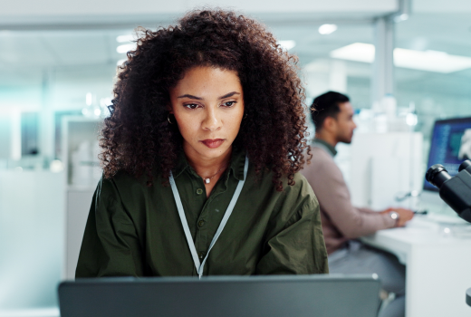 AI developer navigating security threats on laptop