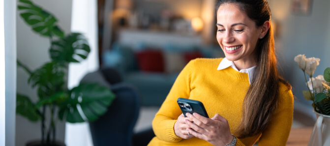 User accessing decentralized application (DApp) on smartphone, built with blockchain development services.